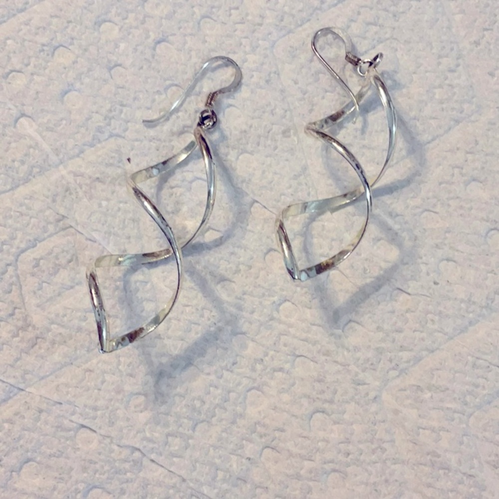 Silver plated dangle earrings that are about 2 inches long and great condition